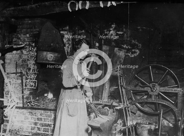 Woman blacksmith, Eng. [i.e. England], between c1915 and 1917. Creator: Bain News Service.