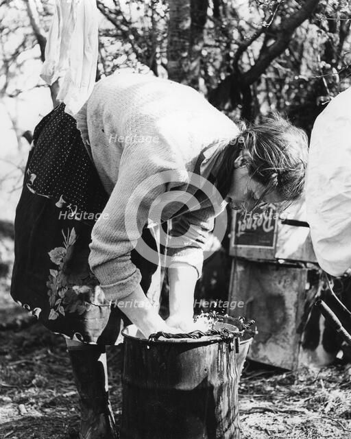 Woman doing the washing, Charlwood, Surrey, 1960s(?).