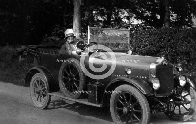 Woman driving a car, 1930. Artist: Unknown