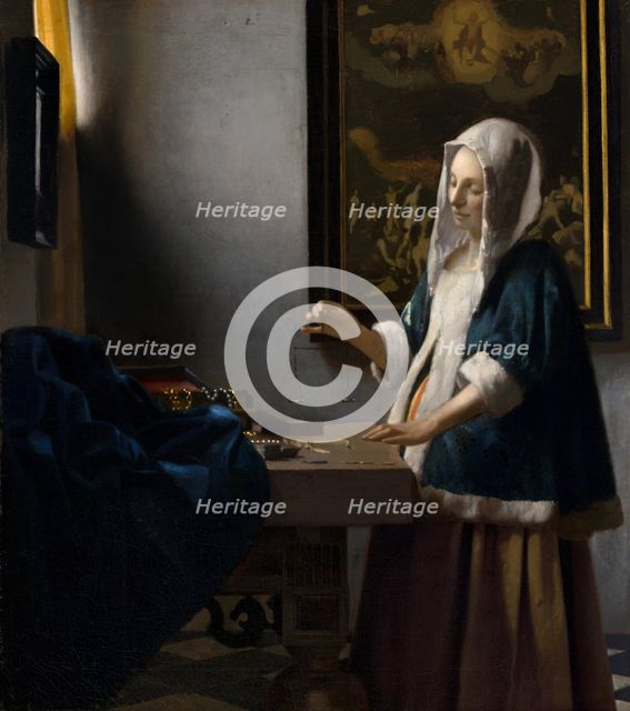 Woman Holding a Balance, c. 1664. Creator: Jan Vermeer.