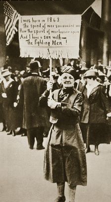 Woman holding a placard in support of the war effort, USA, World War I, c1914-c1918