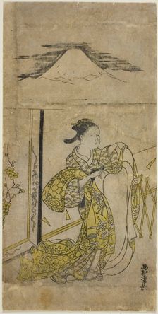 Woman Holding Kimono with Mt. Fuji above, c. 1740s. Creator: Nishimura Shigenaga