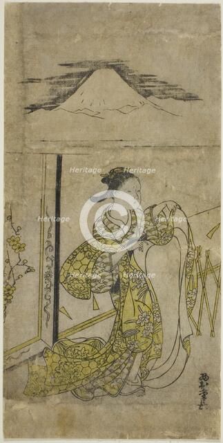 Woman Holding Kimono with Mt. Fuji above, c. 1740s. Creator: Nishimura Shigenaga.