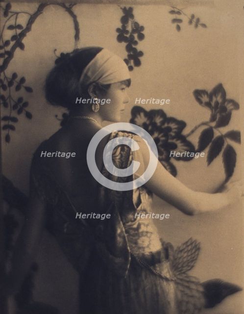 Woman, half-length portrait, facing right, viewed from behind, between 1920 and 1930. Creator: Adolph de Meyer.