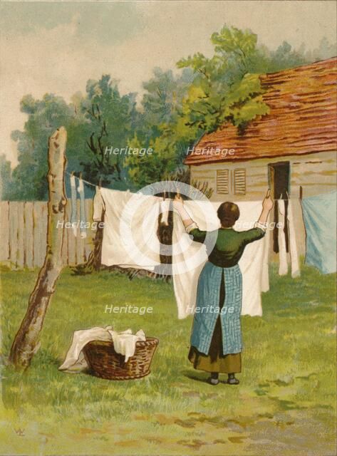 Woman hanging up washing, late 19th-early 20th century? Creator: Unknown.