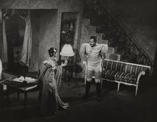 Woman in evening dress and Rex Ingram, 1938. Creator: Unknown