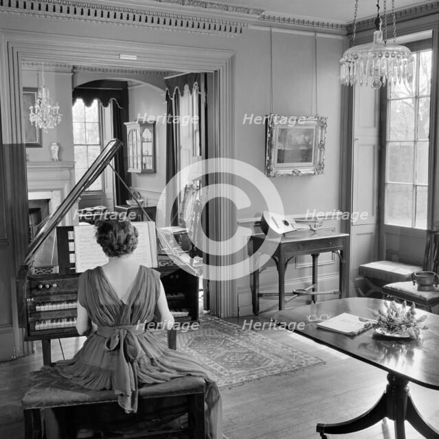 Woman in evening dress playing the harpsichord, Fenton House, London, 1960-1965. Artist: John Gay