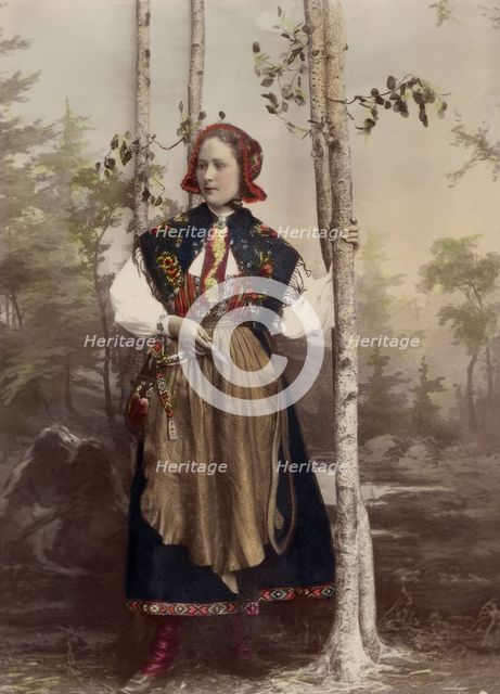 Woman in full figure dressed in costume from Floda parish, Dalarna, 1890-1920.  Creator: Helene Edlund.