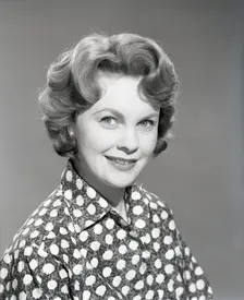 Woman in patterned blouse, c1955. Creator: Arthur Charles Kirby Ware