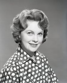 Woman in patterned blouse, c1955. Creator: Arthur Charles Kirby Ware