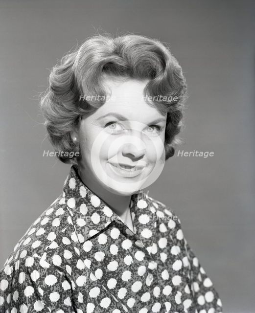 Woman in patterned blouse, c1955. Creator: Arthur Charles Kirby Ware.