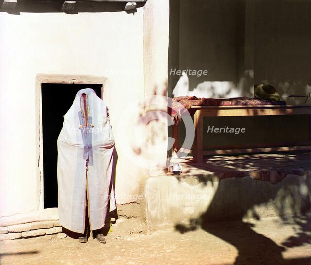 Woman in purdah, standing in front of doowrway, between 1905 and 1915. Creator: Sergey Mikhaylovich Prokudin-Gorsky.