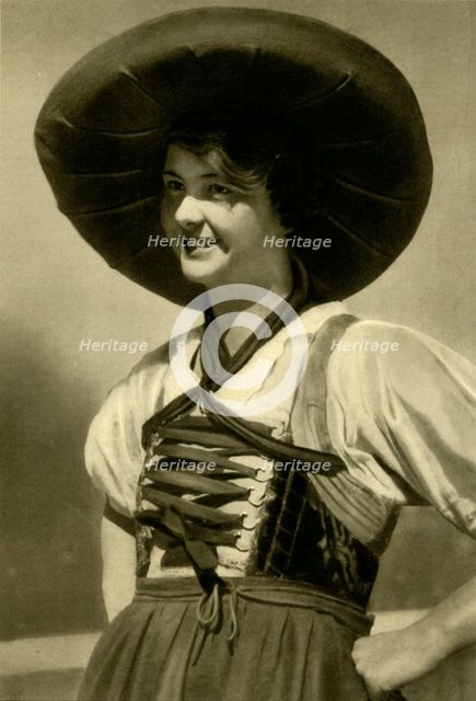 Woman in traditional costume, Tyrol, Austria, c1935.  Creator: Unknown.