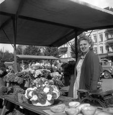 Woman on her flower stall in the market, Malmö, Sweden, 1947. Creator: Otto Ohm
