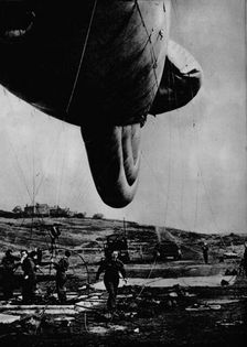 Woman of the WAAF handling a barrage balloon, 1943