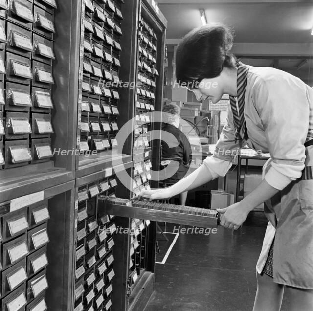Woman looking through index cards, Medical Mailing Company, Ealing, London, 1960-1970. Artist: John Gay