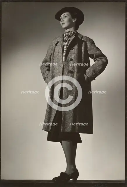 Woman modeling coat, early 1940s. Creator: Gunther Krampf.