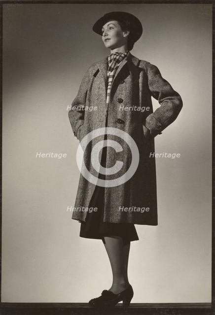 Woman modeling coat, early 1940s. Creator: Gunther Krampf.