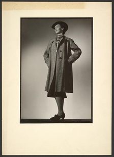 Woman modeling coat, early 1940s. Creator: Gunther Krampf