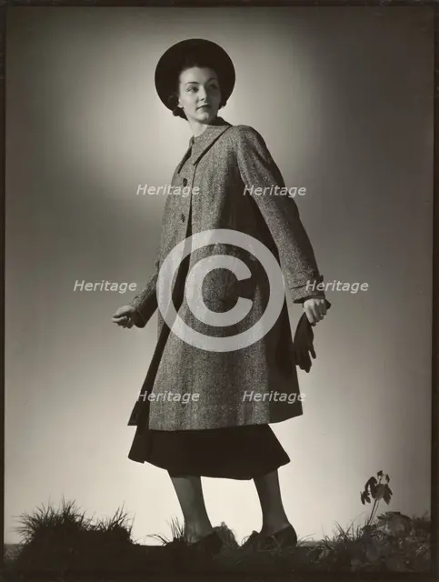 Woman modeling coat, early 1940s. Creator: Gunther Krampf.