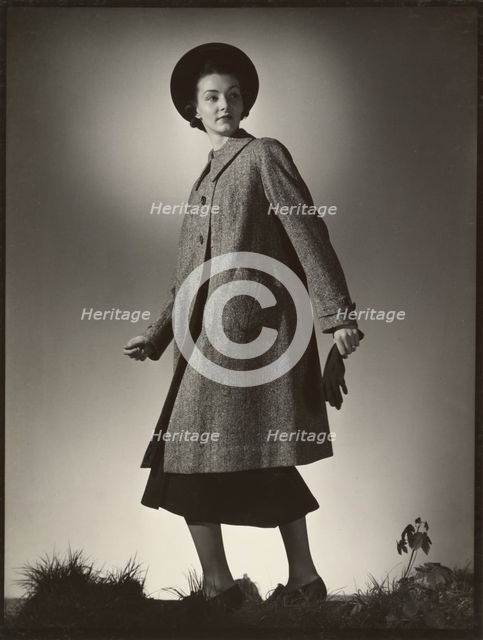 Woman modeling coat, early 1940s. Creator: Gunther Krampf.