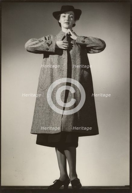 Woman modeling a coat, early 1940s. Creator: Gunther Krampf.