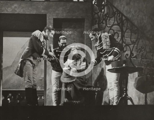 Woman smiling, surrounded by three men, 1938. Creator: Unknown.