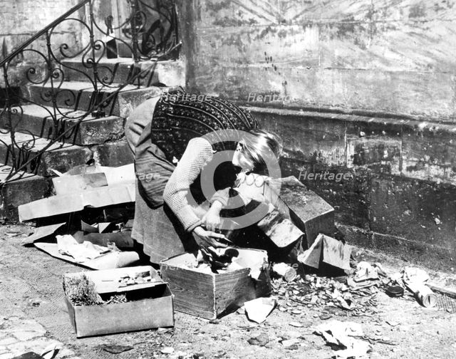 Woman scavenging for food, Bayreuth, Germany, April 1945. Artist: Unknown