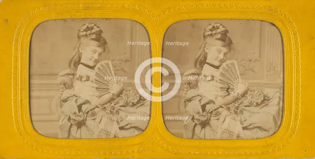 Woman seated on a divan holding a hand fan, 1860s. Creator: E Lamy.