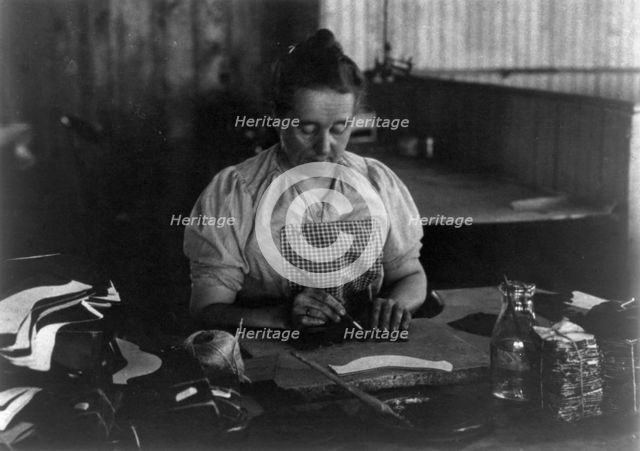 Woman seated at a table, working in a shoe factory, Lynn, Mass., (1895?). Creator: Frances Benjamin Johnston.