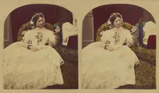 Woman seated in enlongated chair admiring herself in a hand mirror, about 1865. Creator: London Stereoscopic & Photographic Co