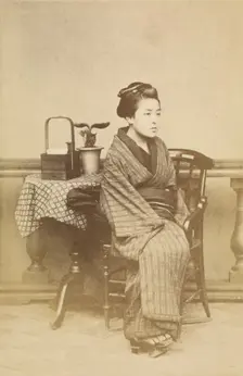 Woman sitting by table, about 1868. Creator: Felice Beato