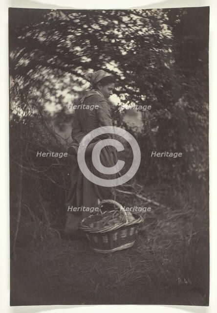 Woman Standing with Basket on Ground, 1870. Creator: Giraudon's Artist.