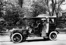 Woman stands by a 1907/8 Daimler