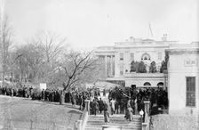 Woman Suffrage - at White House with Banners, 1914. Creator: Harris & Ewing