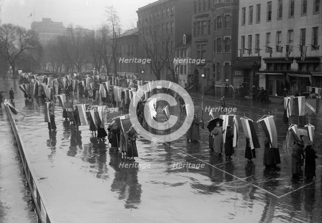 Woman Suffrage - Marching in Rain, 1917. Creator: Harris & Ewing.