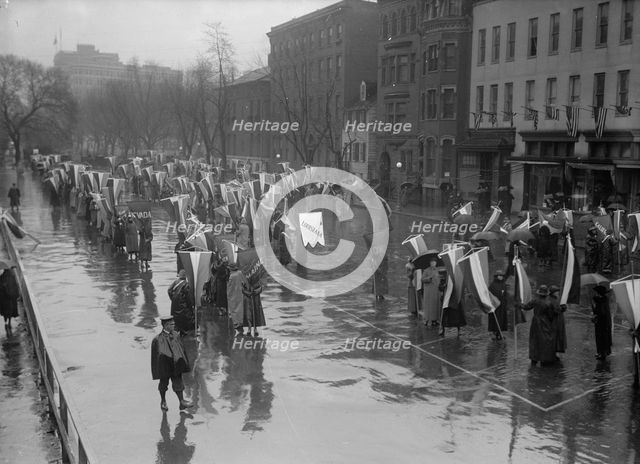 Woman Suffrage - Marching in Rain, 1917. Creator: Harris & Ewing.