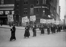 Woman Suffrage - Marching with Inv. Signs, 1917. Creator: Harris & Ewing