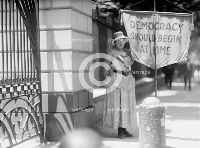 Woman Suffrage - Mrs. Swing, Picketing White House, 1917. Creator: Harris & Ewing.