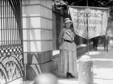 Woman Suffrage - Mrs. Swing, Picketing White House, 1917. Creator: Harris & Ewing