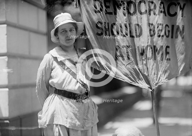Woman Suffrage - Mrs. Swing, Picketing White House, 1917. Creator: Harris & Ewing.