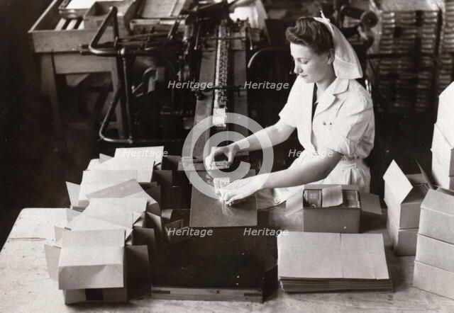 Woman packing Kit Kat into boxes, Rowntree factory, York, Yorkshire, 1949. Artist: Unknown
