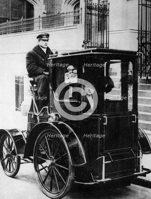 Woman passenger in a 1910 taxi cab, New York, USA, (c1910?). Artist: Unknown