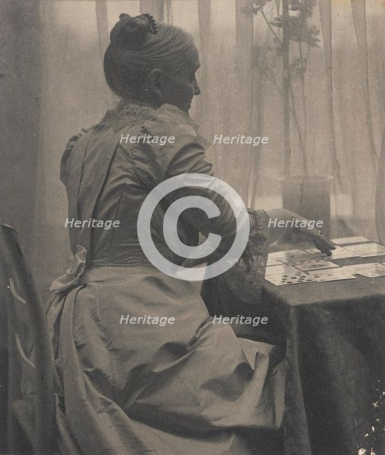 Woman Playing Solitaire, c.1910. Creator: Gertrude Kasebier.