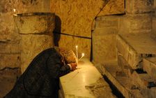Woman praying, Basilica of the Holy Sepulchre, Jerusalem, Israel, 2014. Creator: LTL