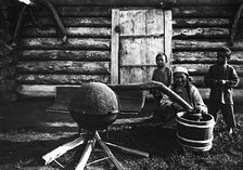 Woman preparing tarasun, 1890. Creator: Unknown