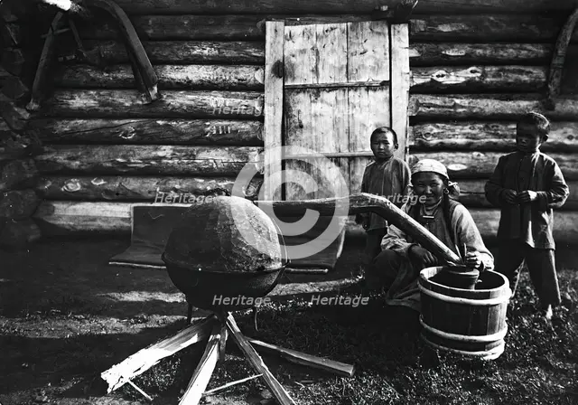 Woman preparing tarasun, 1890. Creator: Unknown.