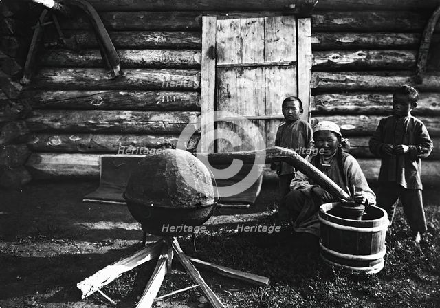 Woman preparing tarasun, 1890. Creator: Unknown.