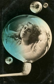 Woman reflected in a bubble, postcard, c1890-c1909(?)