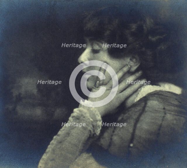 Woman resting her head on her left hand, head-and-shoulders profile portrait, c1900. Creator: Unknown.
